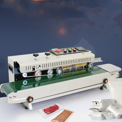 Machine de scellement automatique en bande continue pour sacs en plastique